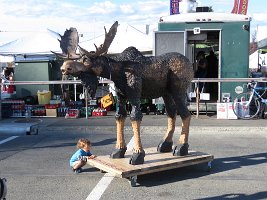 IMG 8776  Stewie the wood carved Moose with Phelan, Anchorage Market Festival, Anchorage, AK