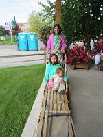 IMG 5411  Julie, Megan and Phelan on Traditional Dog Sled, Ulu Factory Store, Anchorage, AK