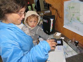 IMG 7355  Phelan and Julie Stamping their National Park Passport Book, Exit Glacier Visitor Center, Kenai Fjords National Park