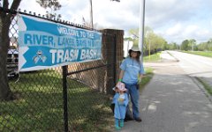 IMG_1416 Standing with Mommy in front of the Trash Bash Sign