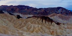 ZabriskiePoint-Sunrise-DVNP Panoramic view of the badlands around Zabriskie Point, Death Valley National Park