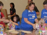 IMG 3106  zip tying the packbacks closed, Houston Food Bank